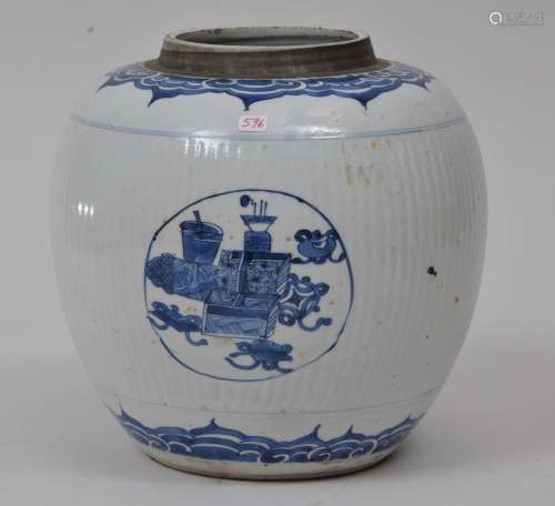 Porcelain jar. China. 19th century. Underglaze blue decoration of reserves of The Hundred Antiques on a ribbed ground. Ju-i.  8