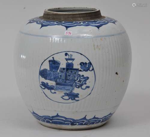 Porcelain jar. China. 19th century. Underglaze blue decoration of reserves of The Hundred Antiques on a ribbed ground. Ju-i.  8