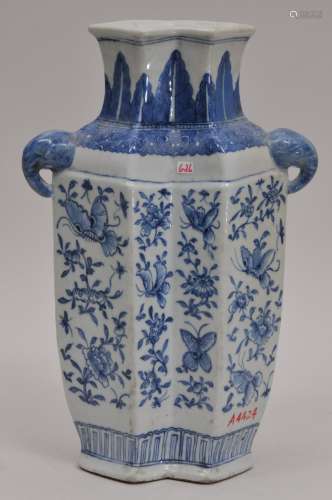 Porcelain vase. China. 19th century. Double form with elephant head handles. Underglaze blue decoration of birds and flowers. 12-1/4