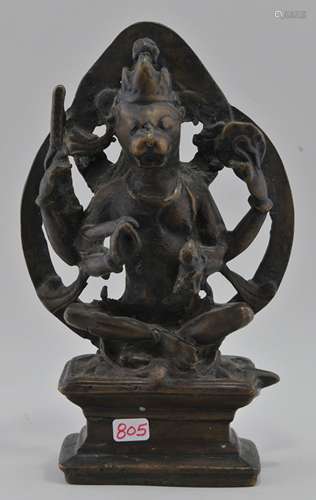 Bronze of a Deity. India. 19th century or earlier. Crowned lion headed figure with four arms. 6-1/2