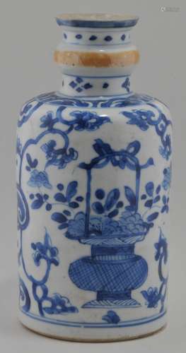 Porcelain bottle. China. K'ang Hsi period (1662-1722). Decoration of underglaze blue baskets of flowers. Cafe au Lait band around the neck. Truncated. 7