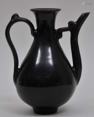 Porcelain wine ewer. China. Late 19th cent. Aubergine glaze. Ch'eng Hua mark on the base. 6-1/2