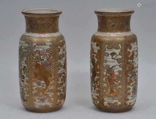 Pair of pottery vases. Japan. 19th century. Cylindrical form. Decoration of panels of Immortals and birds and flowers. 11-1/4