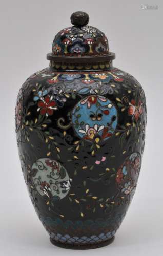Cloisonné covered jar. Japan. Meiji period. (1868-1912). Sukashi Jippo technique. Flower on a black ground. 8