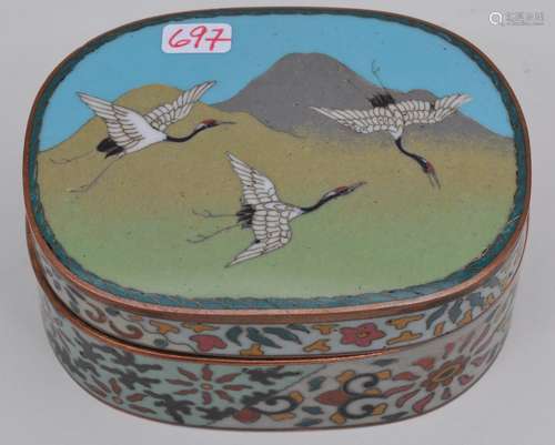 Oval Cloisonné box. Japan. Meiji period. (1868-1912). Silver wire work of cranes and mountains. Brocade sides. 3-1/2