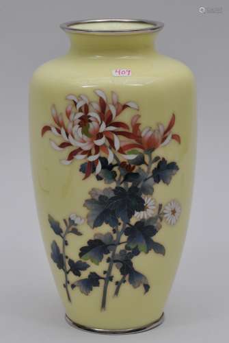 Cloisonné vase. Japan. Circa 1950. Pale yellow ground with  standard cloisonné flowers. Signed Ando. 8-3/4
