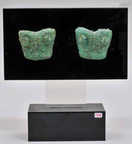 Pair of bronze fittings. China. Probably Chou period. 9c BC Rams heads. Surface of malachite and azurite. Each about 2