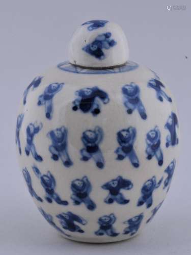 Small covered jar. China. 19th century. Soft paste steatitic ware. Underglaze blue decoration of  children playing. Yung Cheng mark. 3-1/4
