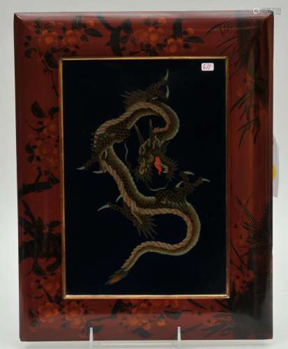Cloisonné panel. Japan. Meiji period. (1868-1912). Dragon on a midnight blue ground. Lacquered frame with cherry blossoms. 10