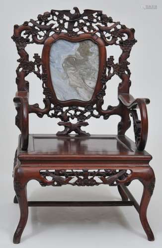 Rosewood chair. China. 19th century. Marble inset back. Surface carved with flowering trees and birds. 40