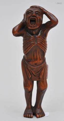 Wooden Netsuke. Japan. 19th century. Man yawning. Signed Sekigawa.