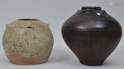 Lot of two stoneware jars. China. 19th century or earlier. One with a brown glaze, the other straw coloured. 12