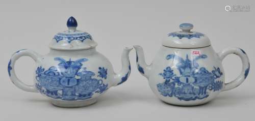 Two porcelain teapots. China. 19th century. Underglaze blue decoration of The Hundred Antiques. Each about 4-1/2