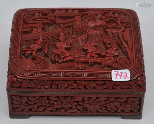 Rectangular box. China. Early 20th century. Cinnebar lacquer carved with a landscape and floral borders. 4