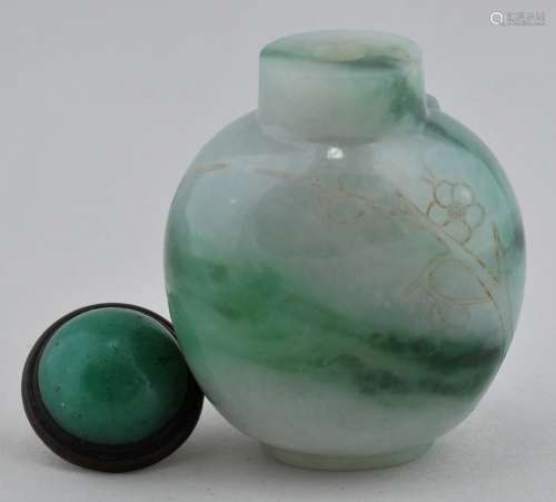 Jadeite Snuff bottle. China. Early 20th century. Areas of bright green. Engraved with two figures on a raft. 2