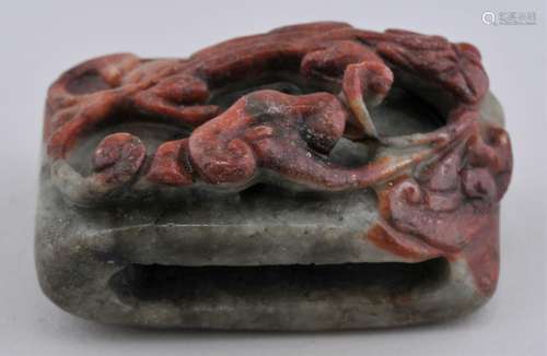 Jade belt plaque. China. 19th century. Grey green stone with red markings. Carved with a chih lung with a ling chih. 2