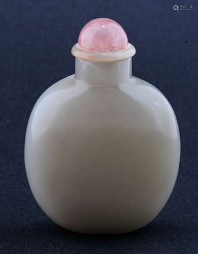 Jade Snuff bottle. China. 19th century. Grey stone with a large area of russet. 2-1/2