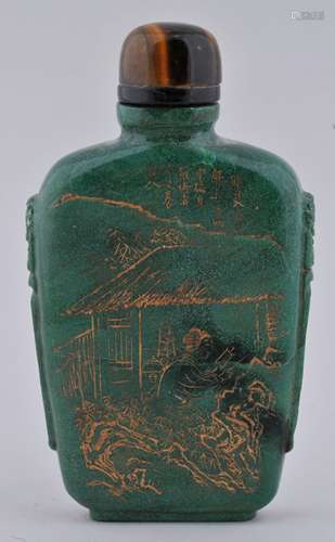 Green stone snuff bottle. China. 19th century. Surface engraved and gilded with figures in a garden. 3