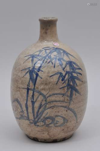 Stoneware sake bottle. Japan. 19th century. Ko Imari ware. Underglaze blue decoration of bamboo. 10-1/2