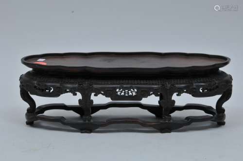 Hardwood stand. China. 18th century. Oval form with archaic scrolling. 11