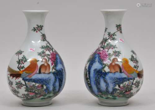 Pair of porcelain vases. China. Early 20th century. Famille Rose decoration of golden pheasants, flowers and fantastic rocks. Yung Cheng marks. 7-3/4
