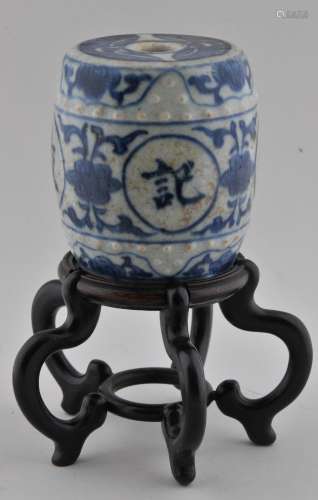 Porcelain brush holder paper weight. China. 19th century. Drum shaped. Underglaze blue decoration of auspicious characters and floral scrolling. Hardwood stand. 3-1/2