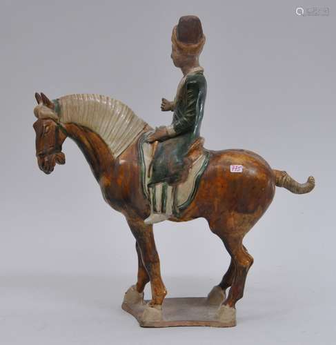 Tomb figure. China. Tang style but probably 20th century. Horse and rider. San Tsai glazed green, amber and straw colour. 13-1/2