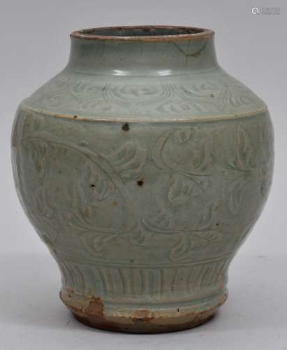 Stoneware jar. China. 14th century. Lung Chuan ware. Celadon glaze with scraffitto carved foliage. Truncated with cracks at the mouth. 7
