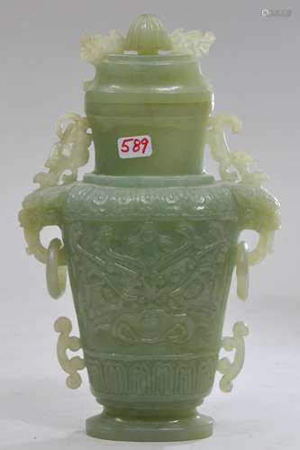 Hardstone covered jar. China. 20th century. Pale green stone. Archaic style carving. 7