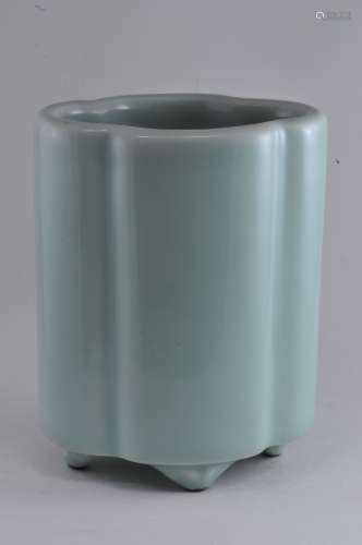 Porcelain brush pot. China. 19th century. Quatrefoil shaped with four feet. Pale celadon glaze. Underglaze blue six character Ch'ien Lung mark on the base. 4-1/2