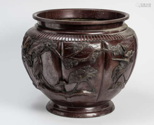 A LARGE BRONZE CACHEPOT WITH CRANES