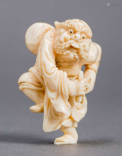 AN IVORY NETSUKE OF TEKKAI SENNIN