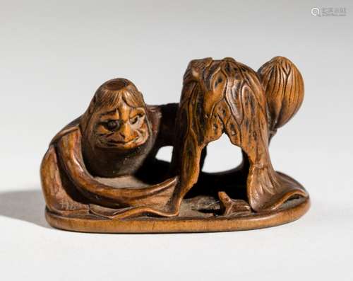 A WOOD NETSUKE BY MASATSUGU OF KAPPA, LOTUS AND FROG