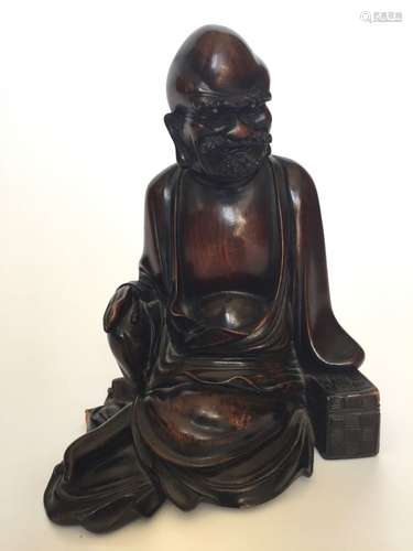 A Carved Wooden Statue of The Taoist Immortal.