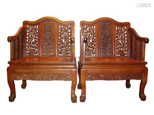 A Pair of Rare Imperial Chinese Huanghuali Armchairs with Dragons, 18 Century.
