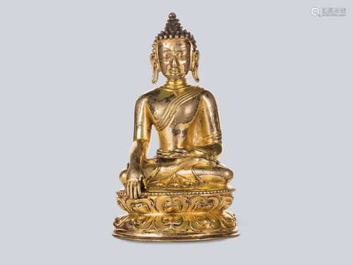 A Gilt Bronze Figure of Shakyamuni, Tibet 14-15th Century.