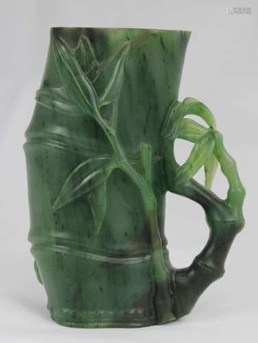 A Spinach-Green Jade Brushpot, Qing Dynasty.