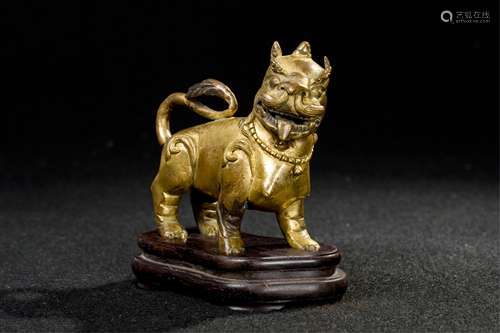 CHINESE GILT BRONZE FOOLION WITH STAND