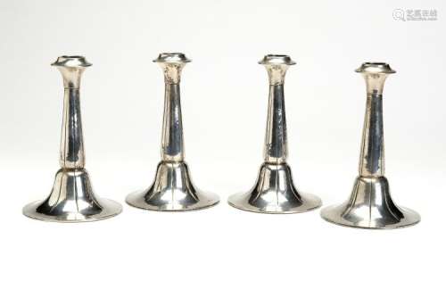 Four silver candlesticks