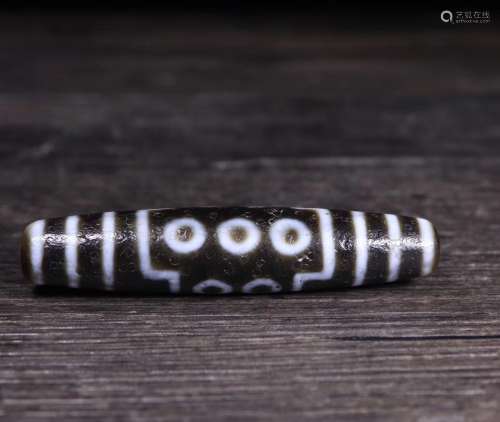 A FOURTEEN-EYE DZI BEAD