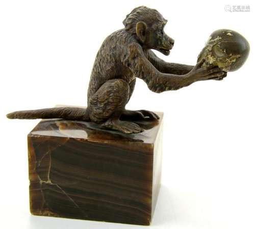 A Vienna bronze of a monkey with a skull