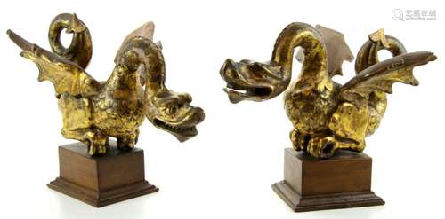 A pair of gilt wooden dragons