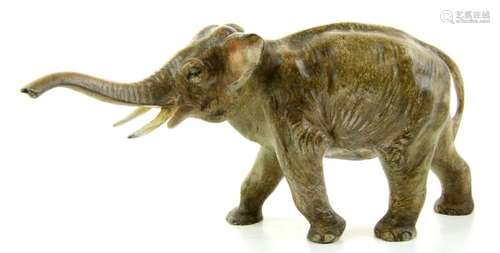 A bronze sculpture of an elephant