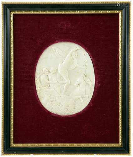 An oval cut ivory plaque