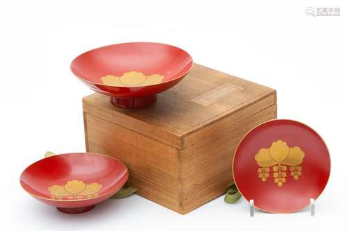 A set of three Japanese lacquer sake dishes