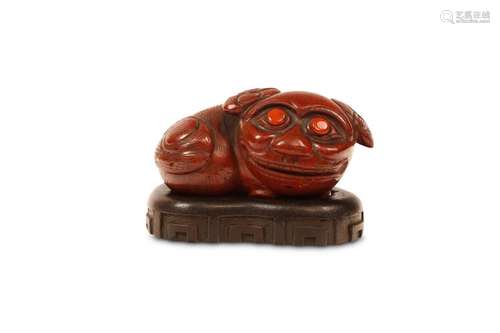 A BLOODSTONE CARVING OF A BUDDHIST LION DOG. Qing