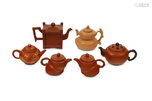 SIX YIXING TEAPOTS AND COVERS. 5.5 – 7.5cm H. (12)