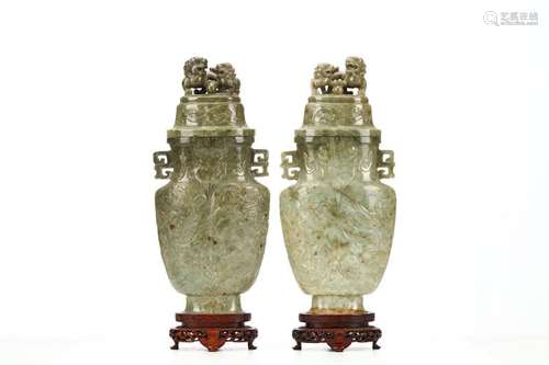 A PAIR OF CARVED JADE ‘DRAGON AND PHOENIX’ VASES A