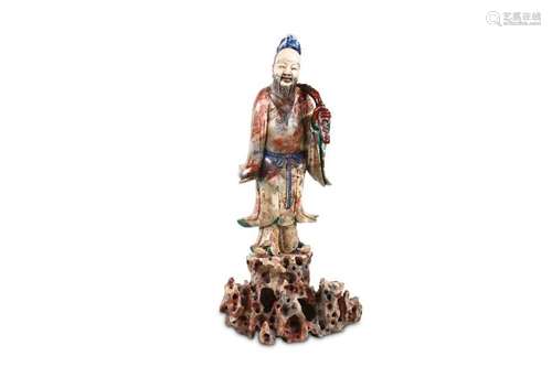 A LARGE CHINESE SOAPSTONE CARVING OF AN IMMORTAL.