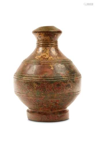 A CHINESE BRONZE VASE, HU. Han Dynasty. The rounde